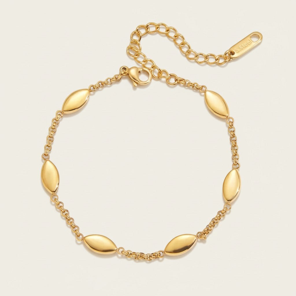 Seraphina Treasures gold-tone stainless steel Niobe bracelet with oval links and adjustable chain.