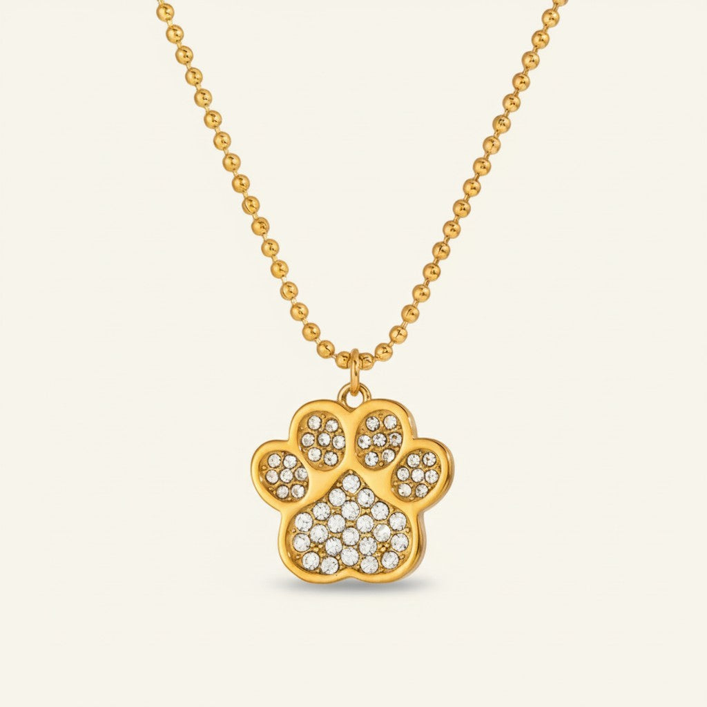 Seraphina Treasures gold paw print necklace with crystal accents. Delicate ball chain.
