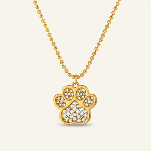 Seraphina Treasures gold paw print necklace with crystal accents. Delicate ball chain.