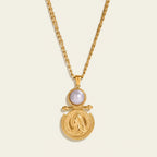 Seraphina Treasures gold necklace with faux pearl and coin pendant, figaro chain.