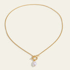 Seraphina Treasures gold chain necklace with a toggle clasp and a single pearl drop pendant.