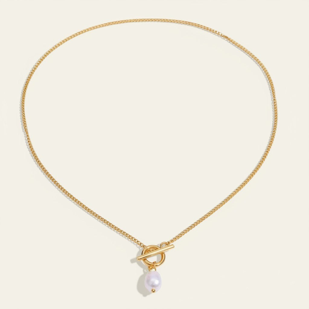 Seraphina Treasures gold chain necklace with a toggle clasp and a single pearl drop pendant.