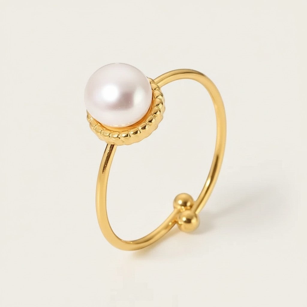Seraphina Treasures gold ring with a single lustrous natural pearl and open design.