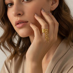 Seraphina Treasures gold ring with layered band and delicate faux pearl tassel chain.