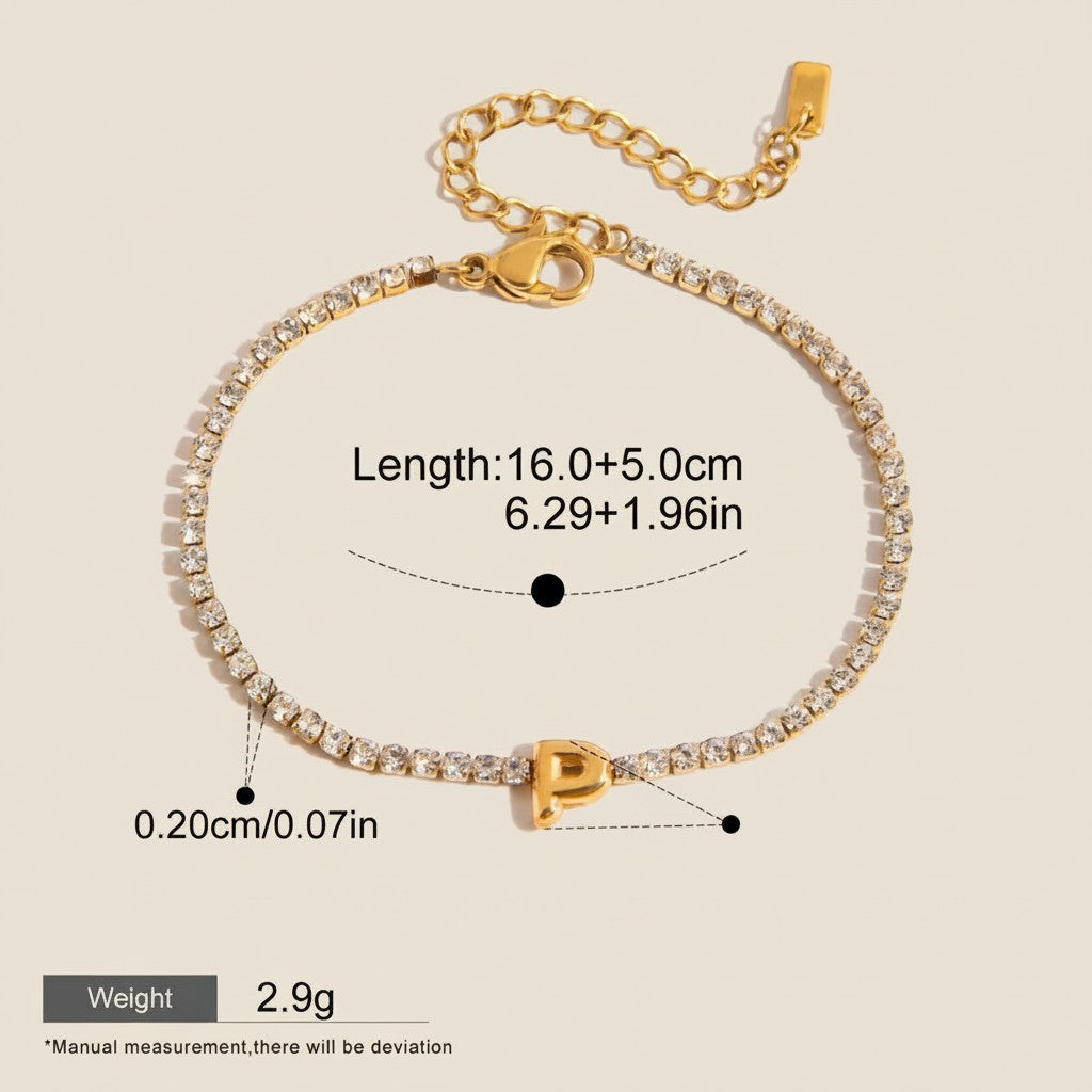 Seraphina Treasures gold-tone bracelet with clear zirconia stones and a gold initial 'P' pendant. Adjustable length, waterproof and hypoallergenic.