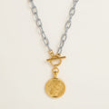 Seraphina Treasures mixed-color Solythera necklace with gold portrait coin pendant and toggle clasp.