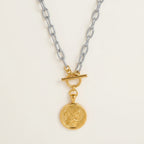 Seraphina Treasures mixed-color Solythera necklace with gold portrait coin pendant and toggle clasp.