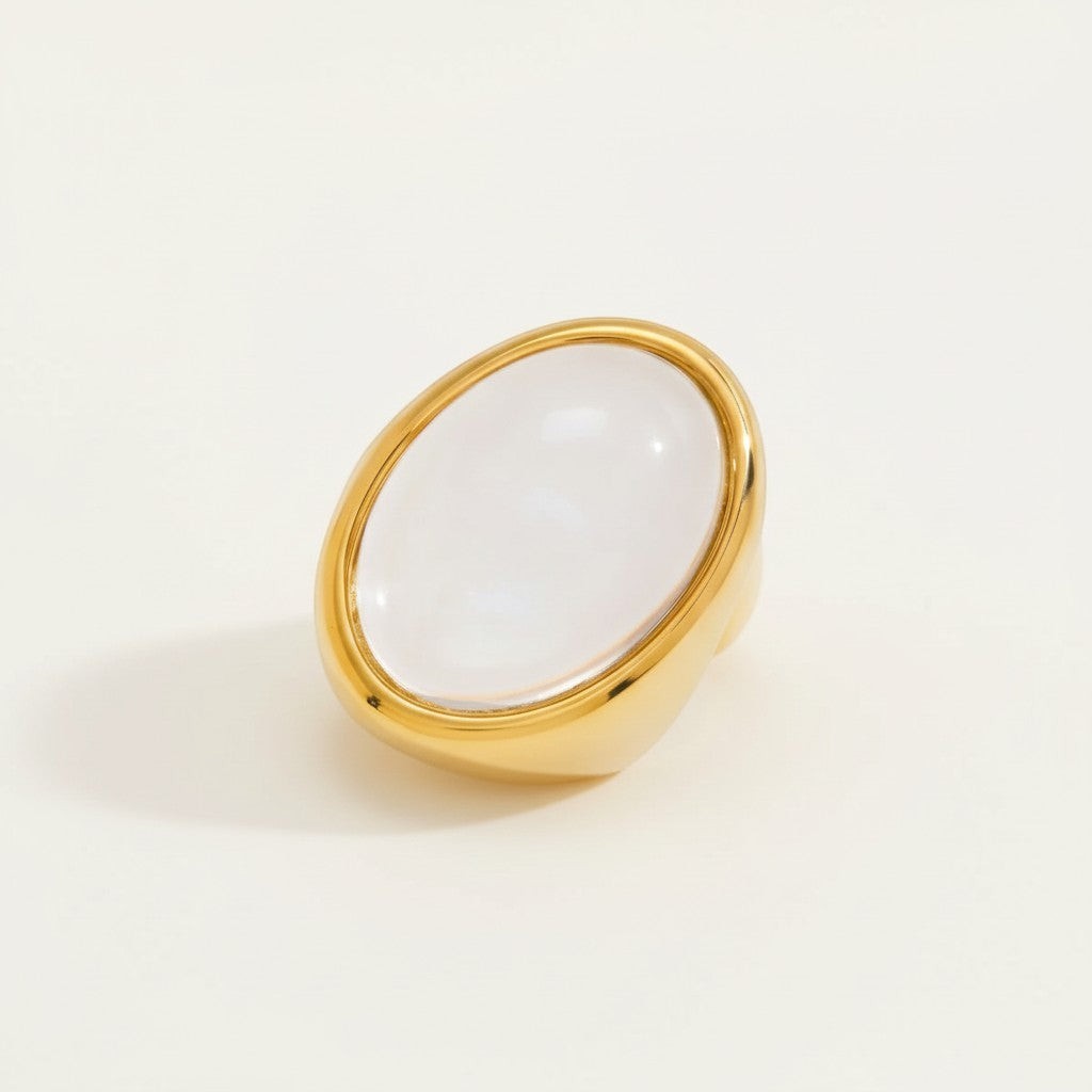 Seraphina Treasures gold ring with a large oval clear resin stone. Minimalist statement jewelry.
