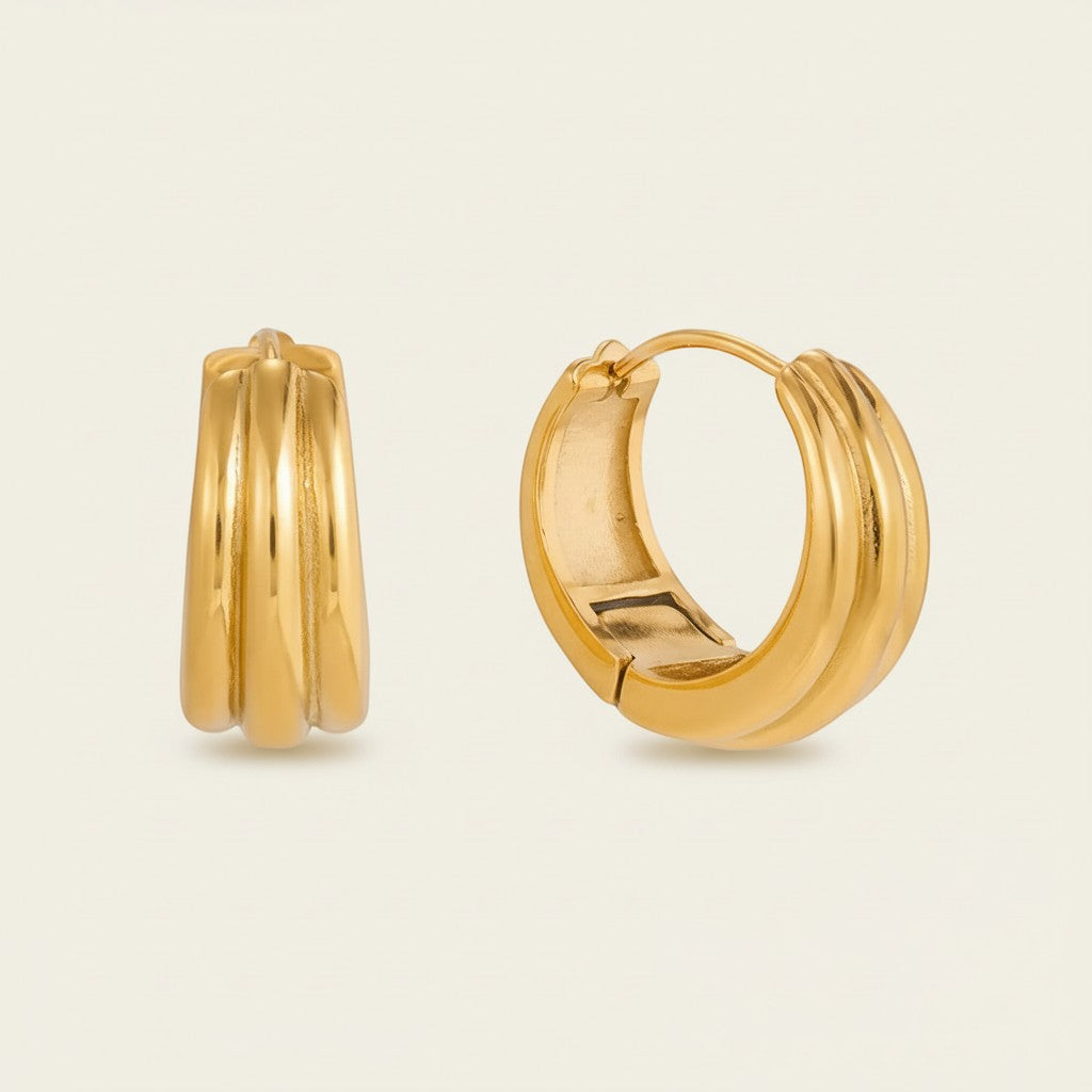Seraphina Treasures gold plated chunky ribbed hoop earrings. Statement dimensional design.