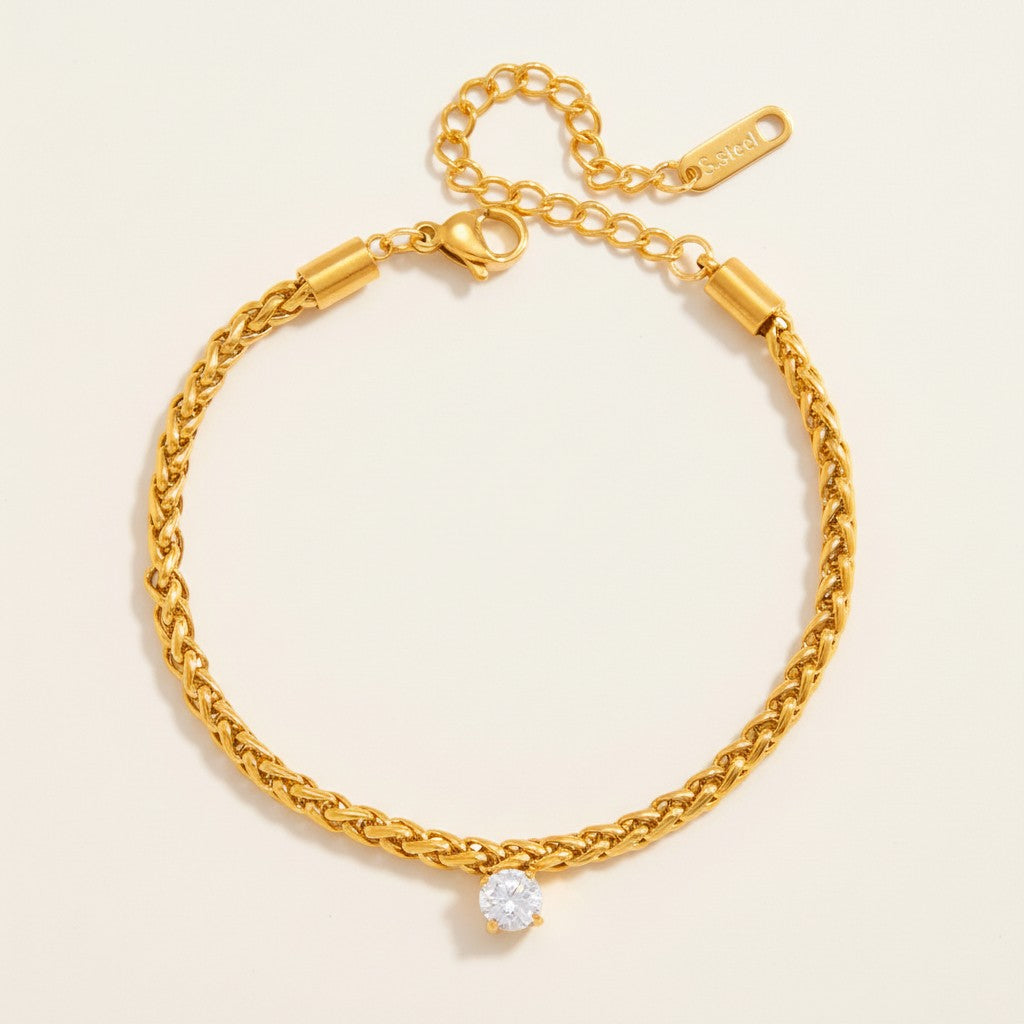 Seraphina Treasures gold rope chain bracelet with a single round zircon stone. Adjustable clasp.