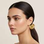 Seraphina Treasures gold fossil shell hair rope with black elastic band.