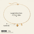 Seraphina Treasures gold necklace with shell and starfish charms, accented with white zircon. Adjustable length.