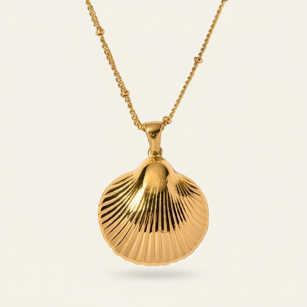 Seraphina Treasures gold shell pendant necklace with beaded chain, inspired by nature.
