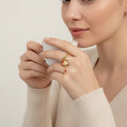 Seraphina Treasures gold ring with shell, coral, and pearl charms. Ocean-inspired design.