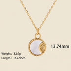 Seraphina Treasures gold necklace with a round pendant featuring a white shell inlay and a sunburst design.
