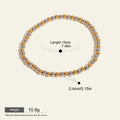 Seraphina Treasures Clio bracelet with alternating gold and silver stainless steel beads. Elastic design for a comfortable fit.