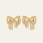Seraphina Treasures Alkymera two-tone gold and silver bowknot stud earrings.