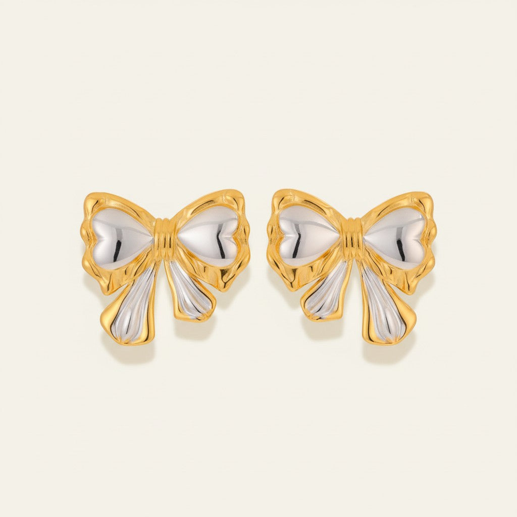 Seraphina Treasures Alkymera two-tone gold and silver bowknot stud earrings.