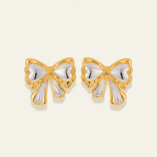 Seraphina Treasures Alkymera two-tone gold and silver bowknot stud earrings.