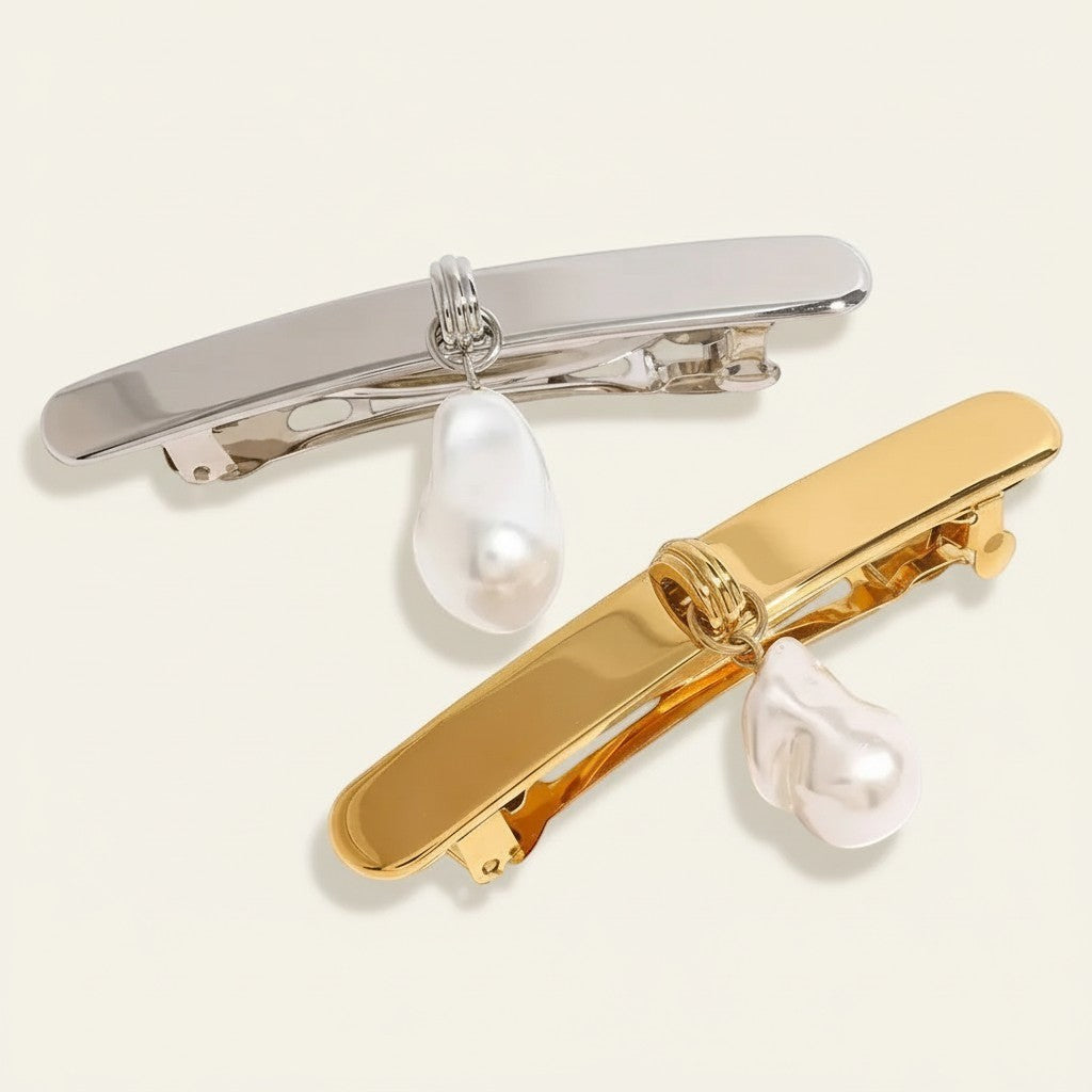 Seraphina Treasures elegant gold and silver hair clips with baroque pearl charms. Perfect for adding a sophisticated touch to any hairstyle.