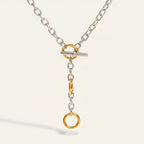 Seraphina Treasures Orphynne necklace with silver chain, gold toggle clasp, and dangling gold rings.