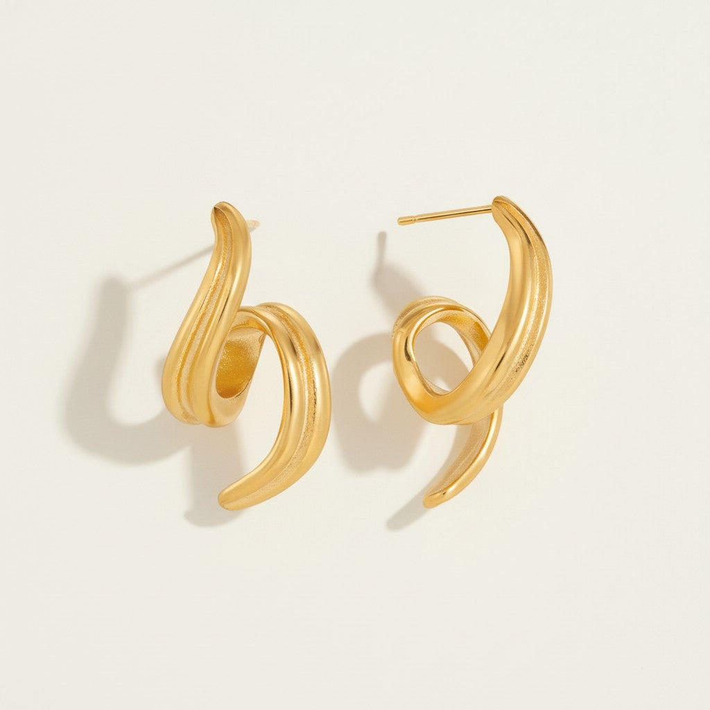 Seraphina Treasures gold spiral stud earrings with a subtle geometric design and secure backing.