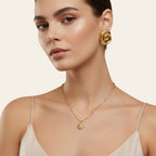 Seraphina Treasures Morviane gold spiral earrings with polished finish. Elegant statement jewelry.