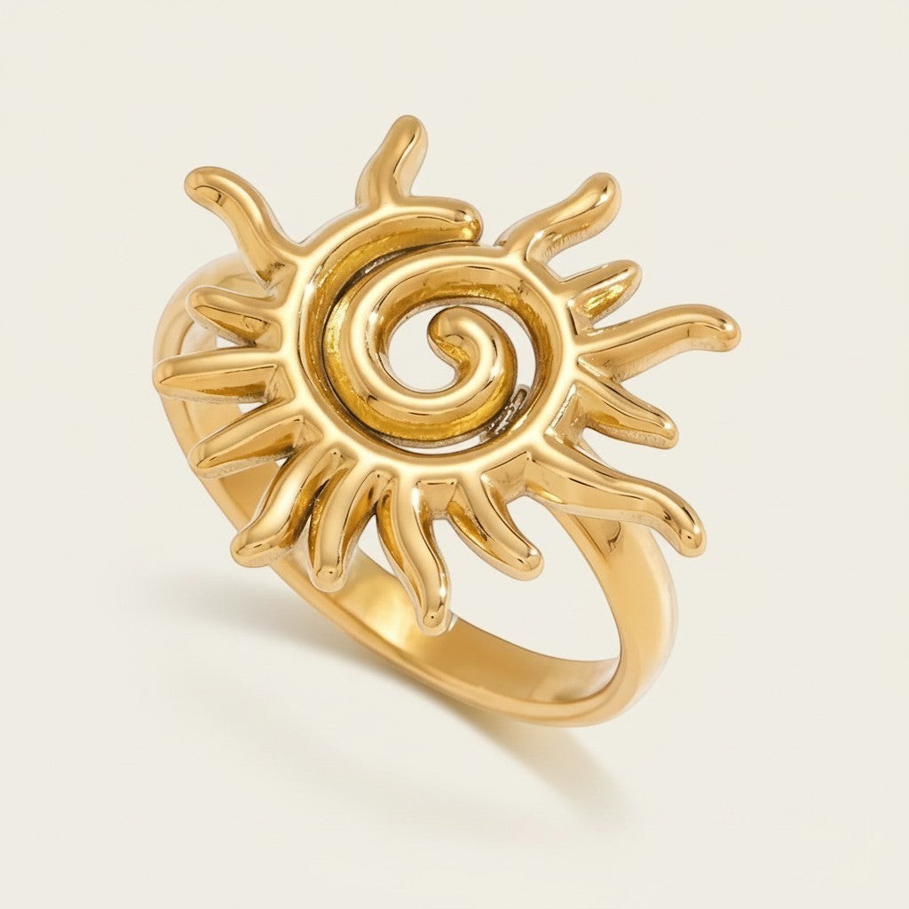 Seraphina Treasures gold spiral sun ring with intricate celestial-inspired design.