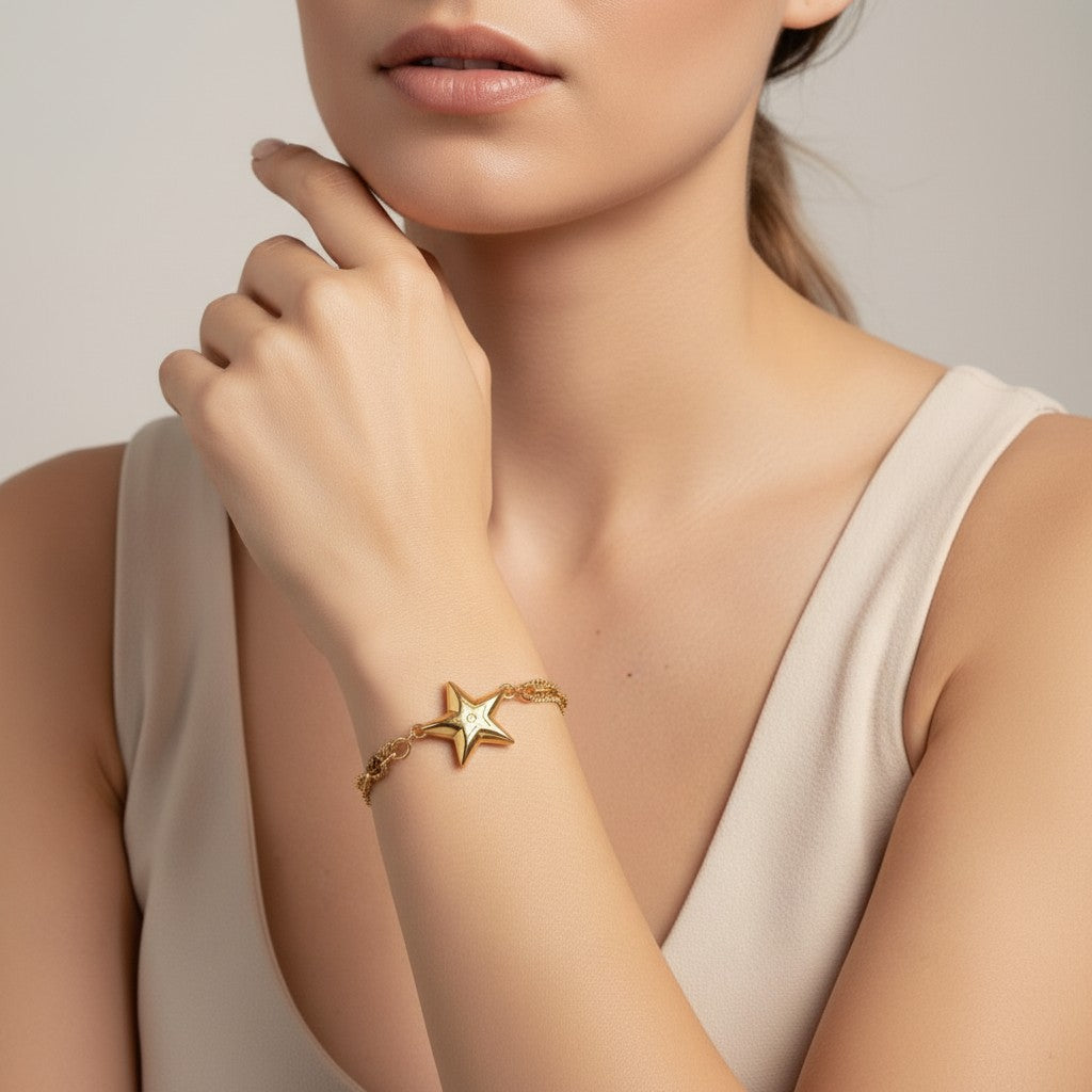 Seraphina Treasures gold-tone bracelet with a star charm, featuring white zircon stones. Elegant accessory for any outfit.