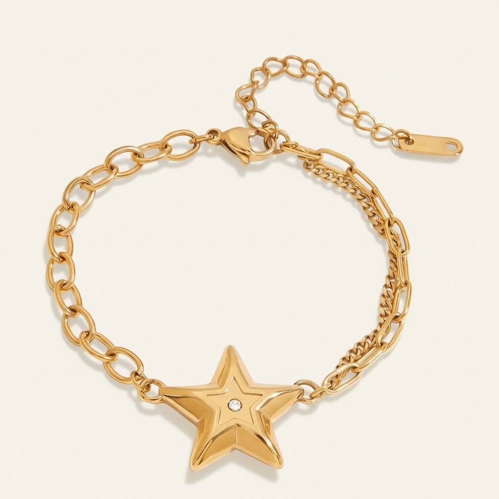 Seraphina Treasures gold-tone bracelet with a double chain design and a central star charm accented with a white zircon.