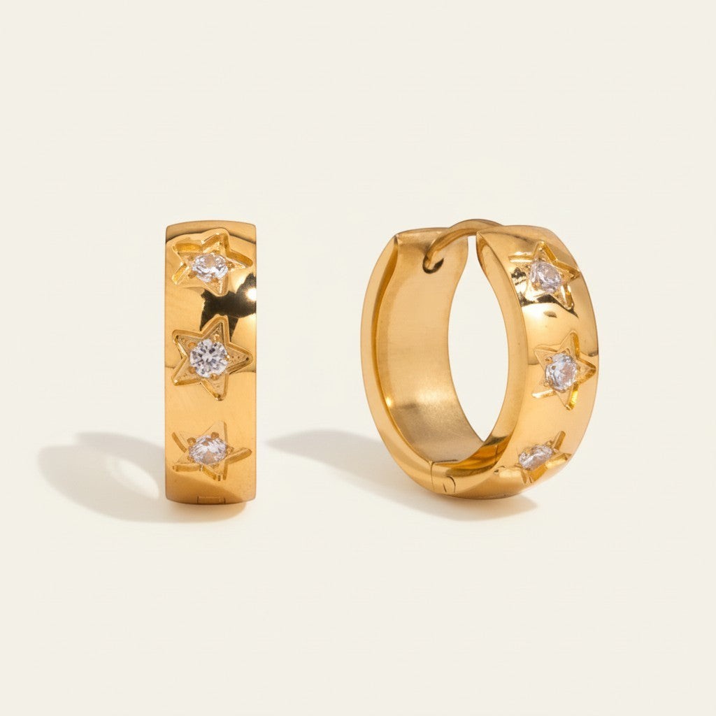 Seraphina Treasures gold hoop earrings with star-shaped zirconia accents.