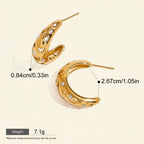 Seraphina Treasures gold hoop earrings with cut-out star and moon designs, accented with cubic zirconia stones.