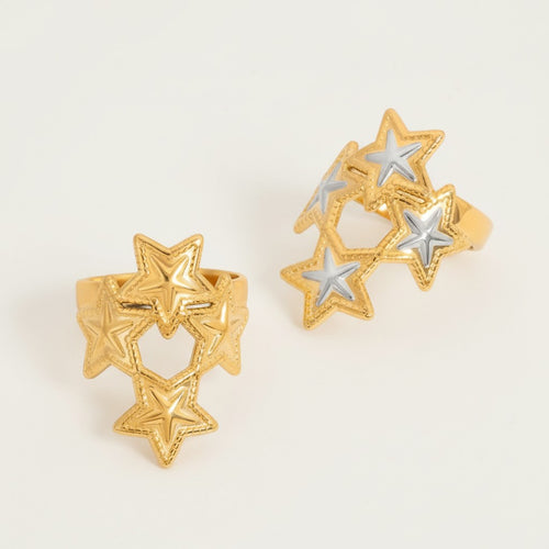 Seraphina Treasures gold open band rings with carved stars design, featuring silver accents.