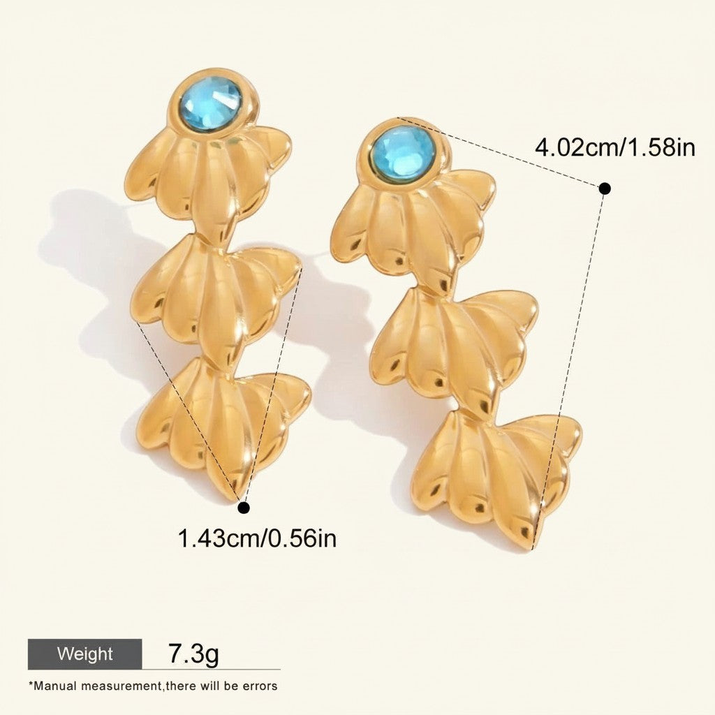 Seraphina Treasures gold starfish dangle earrings with blue gemstone accents. Lightweight and hypoallergenic.