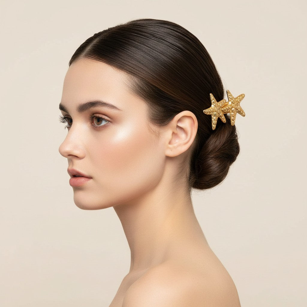 Seraphina Treasures gold-tone hair clip with two textured starfish designs, 6.1cm length.