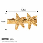 Seraphina Treasures gold-tone hair clip with two textured starfish designs, 6.1cm length.