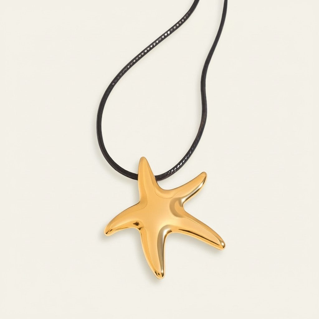 Seraphina Treasures gold starfish pendant necklace on black waxed rope, perfect for everyday wear.