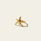 Seraphina Treasures Amaryllis gold starfish ring with textured, ocean-inspired design.