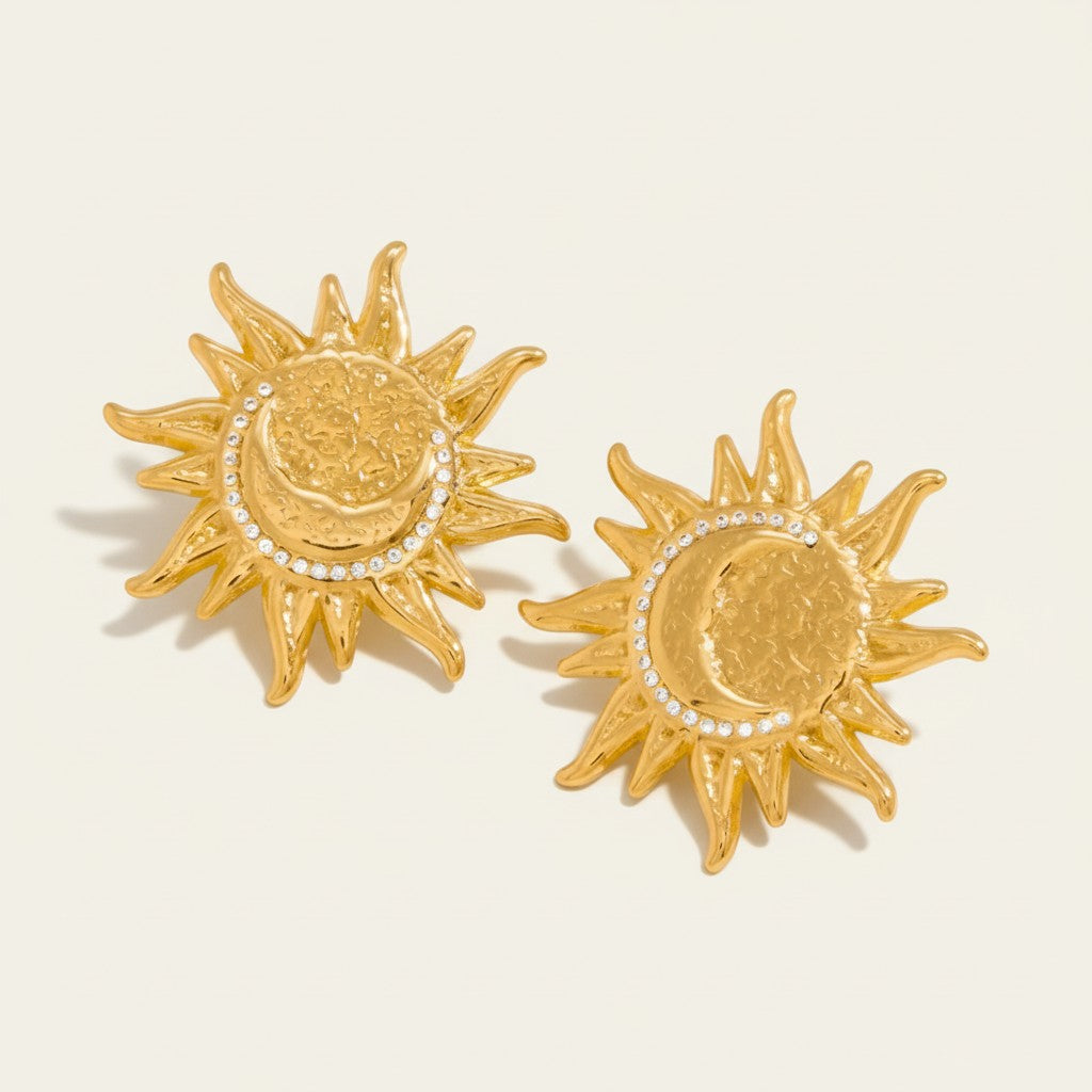 Seraphina Treasures gold sun and moon stud earrings with crystal accents.