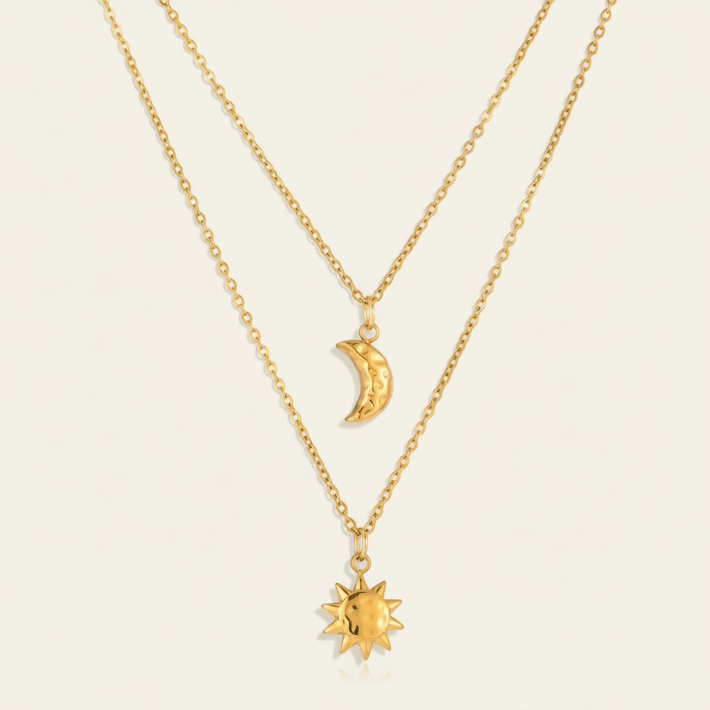 Seraphina Treasures gold layered necklace with hammered sun and moon charms. Minimalist celestial jewelry.