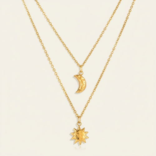 Seraphina Treasures gold layered necklace with hammered sun and moon charms. Minimalist celestial jewelry.