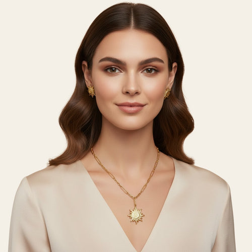 Seraphina Treasures gold sun and moon pendant necklace and matching earrings with crystal accents.