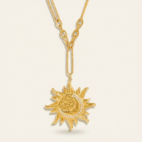 Seraphina Treasures gold sun and moon necklace with crystal accents. Celestial-inspired statement jewelry.