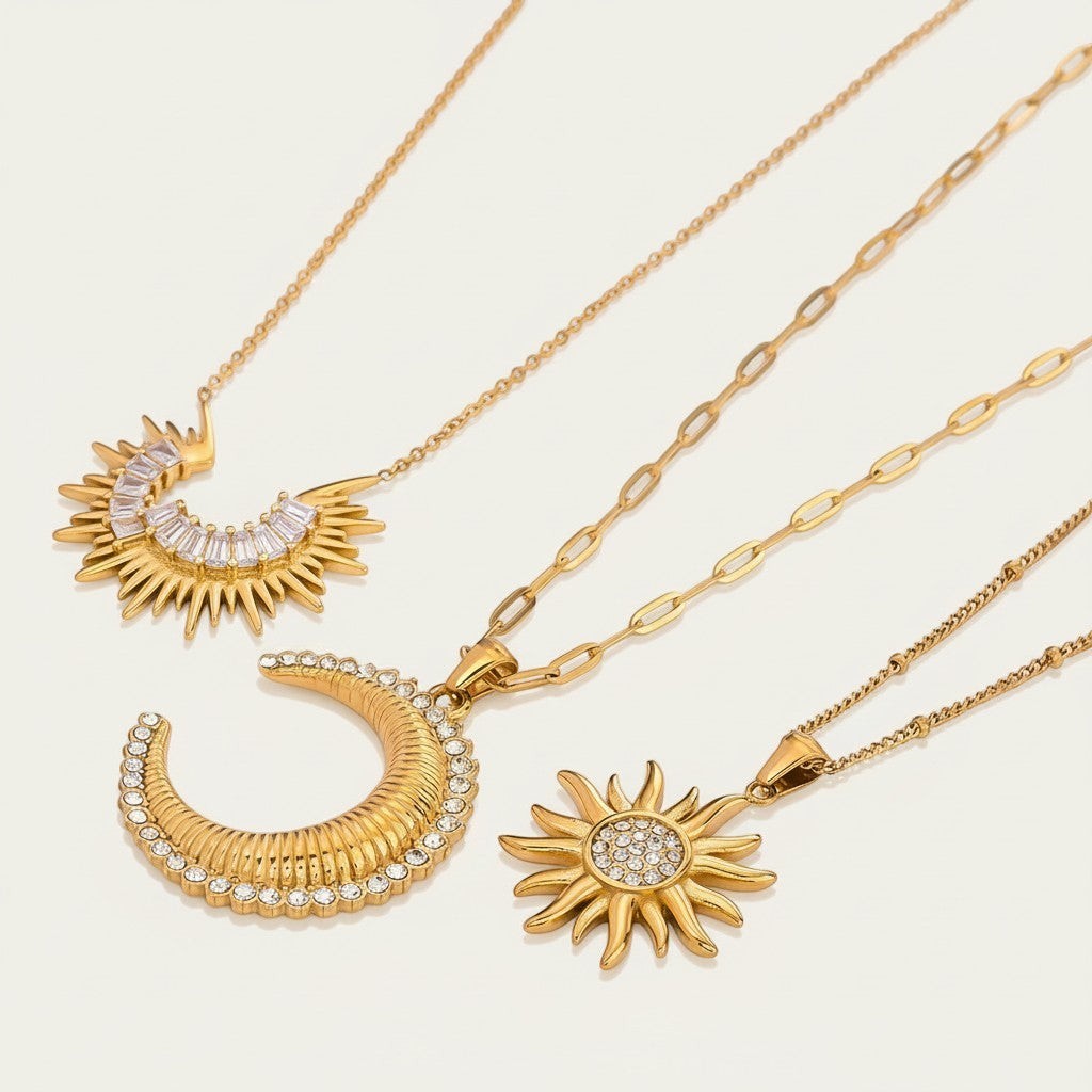 Seraphina Treasures gold necklaces with sun and crescent moon pendants, adorned with zirconia stones.