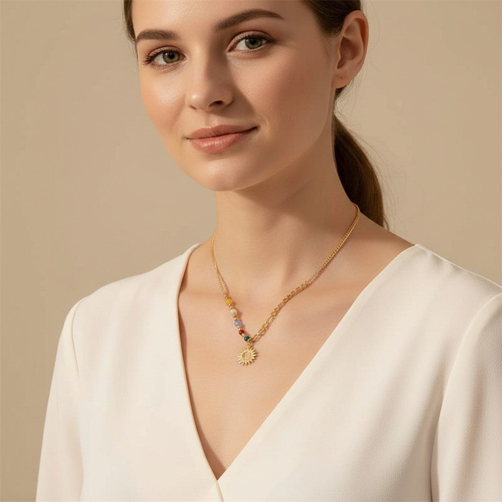 Seraphina Treasures gold-tone necklace with a sun pendant and colorful beaded accents.