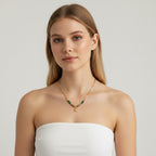 Seraphina Treasures gold necklace with green agate beads, sun pendant, and natural stone accents.