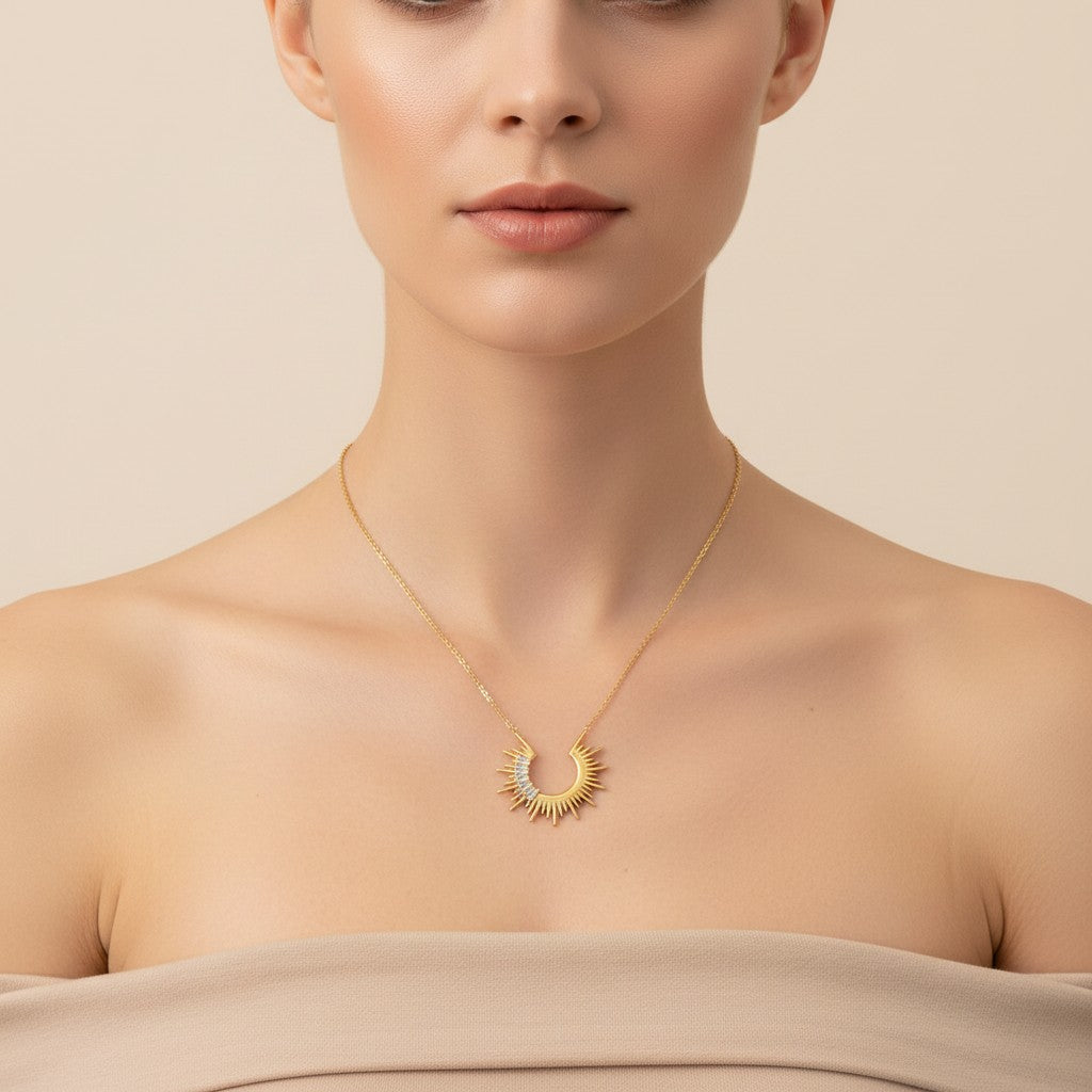 Seraphina Treasures gold-tone sun pendant necklace with clear zirconia stones and adjustable chain.