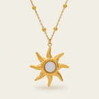 Seraphina Treasures gold sun necklace with white opal center and beaded chain. Celestial-inspired jewelry.