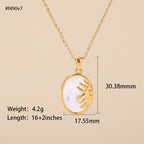 Seraphina Treasures gold sun pendant necklace with natural shell inlay, oval shape, 16+2 inch chain.