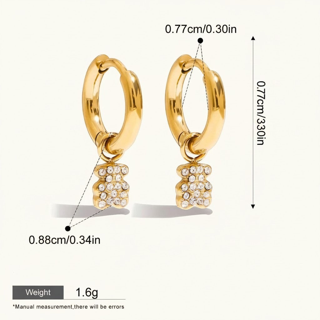 Seraphina Treasures gold-tone hoop earrings with sparkling cubic zirconia teddy bear charms. Waterproof and hypoallergenic.